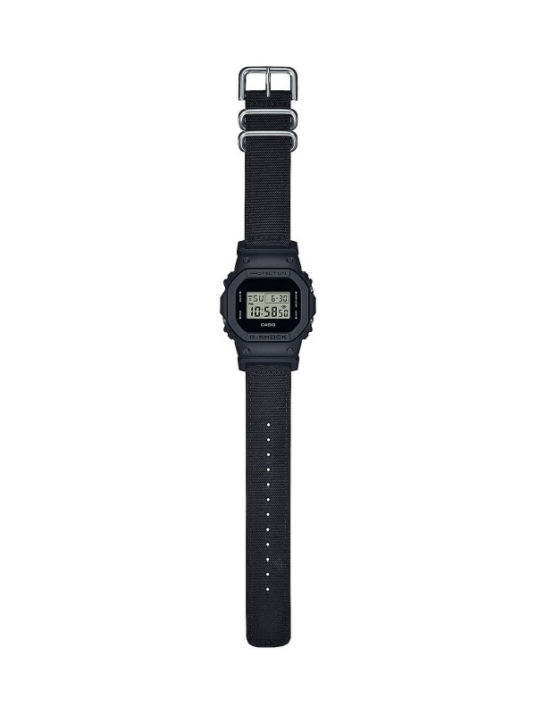 Otkrijte G-SHOCK "Origin" DW-5600BCE-1ER - ikonični muški sat sa crnom platnenom narukvicom i robustnim pravougaonim dizajnom.