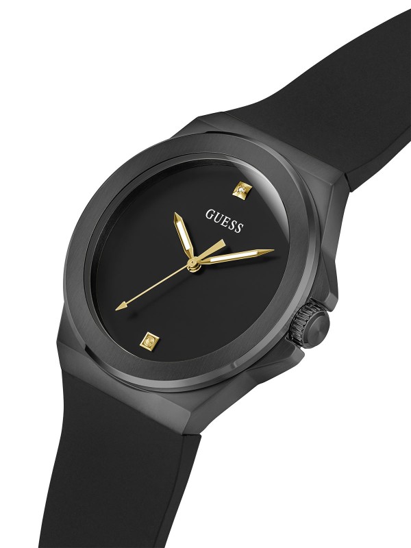 Elegantni muški Guess sat s dijamantom na brojčaniku, crnom silikonskom narukvicom i kazaljkama u boji žutog zlata.