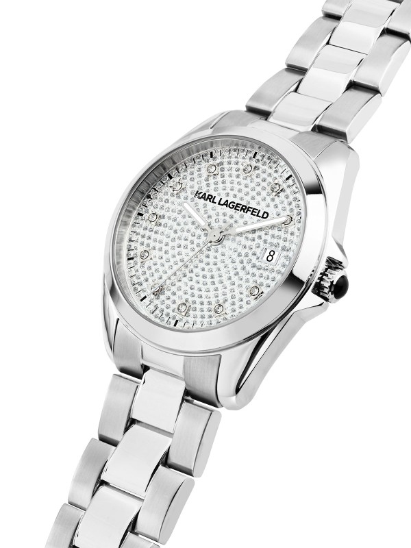 Karl Lagerfeld ROUND ESSENTIALS sat R0553101509 – elegantna ženska verzija od nerđajućeg čelika u boji srebra sa srebrnim brojčanikom optočenim providnim cirkonima i cirkon markerima za sate. Multifunkcijski prikaz datuma, vodootpornost do 50 m.