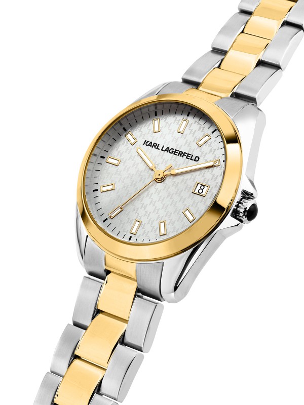Karl Lagerfeld ROUND ESSENTIALS sat R0553101507 – elegantan ženski sat od čelika sa kućištem u boji srebra i zlatnom koronom. Narukvica u dve boje, srebrni sunray brojčanik sa prikazom datuma. Vodootpornost do 50 m.