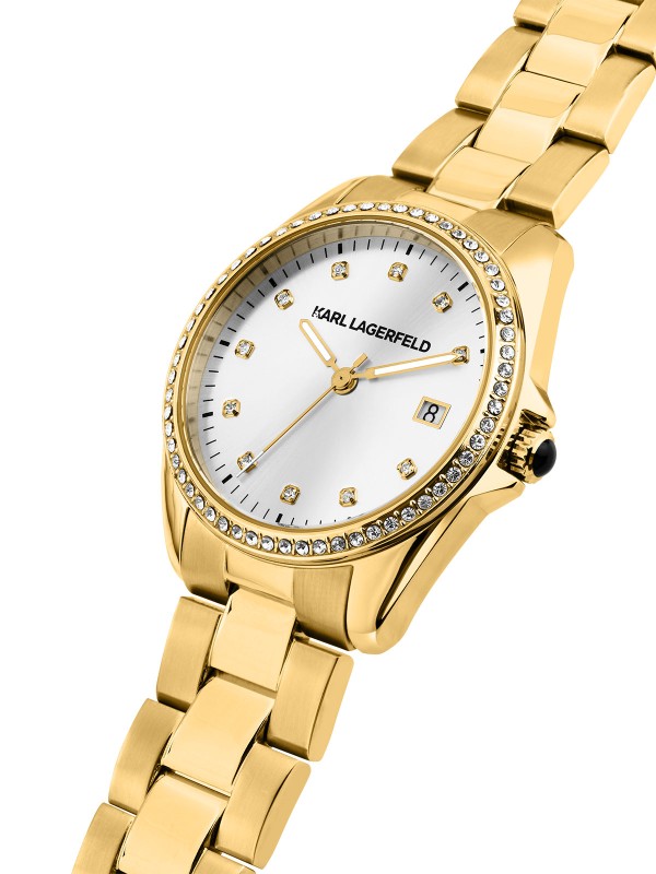 Karl Lagerfeld ROUND ESSENTIALS sat R0553101505 – elegantan ženski sat od nerđajućeg čelika u boji žutog zlata sa cirkonima na kućištu i belim sunray brojčanikom sa cirkon markerima sati. Multifunkcijski mehanizam sa datumom, vodootpornost do 50 m.