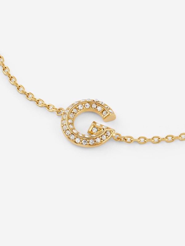 Guess G CRYSTAL JUBB05442JWYGS ženska narukvica od nerđajućeg čelika u boji žutog zlata, ukrašena centralnim slovom G sa cirkonima. Podesiva dužina 14,6 + 3,8 cm.