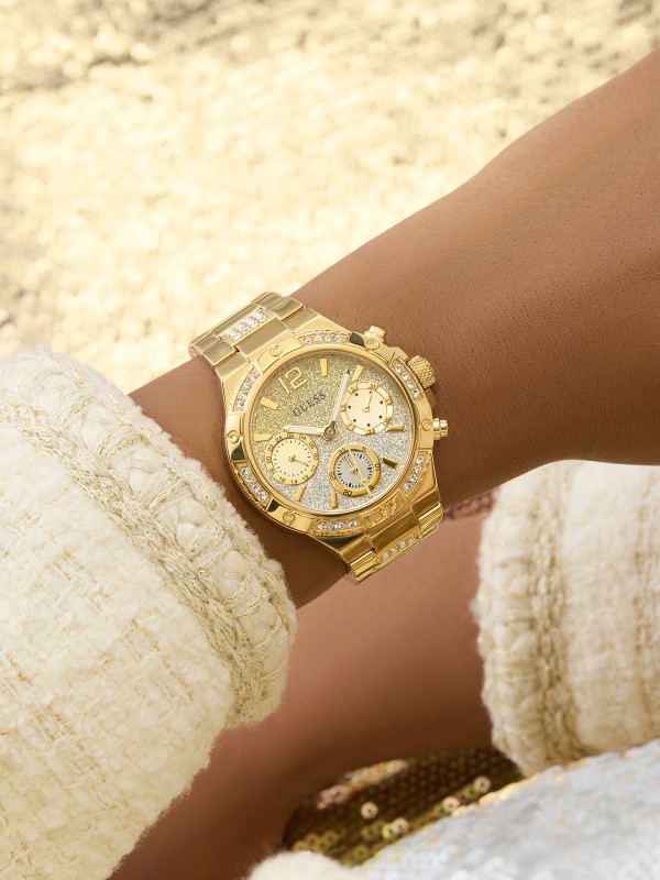 GUESS HARLOW ženski multi-function sat u boji žutog zlata sa sjajnim ombre brojčanikom ukrašenim cirkonima u zlatnim i srebrnim tonovima. Kućište 38 mm sa cirkonima na koroni, vodootpornost 50 m.
