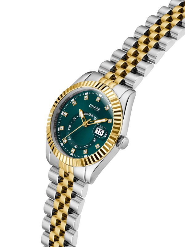 GUESS JADA ženski multi-function sat u kombinaciji srebra i žutog zlata sa zelenim sunray brojčanikom, cirkonima na indeksima i displejem za datum. Kućište 34 mm sa izrezbarenom koronom, jubilee narukvica, vodootpornost 30 m.