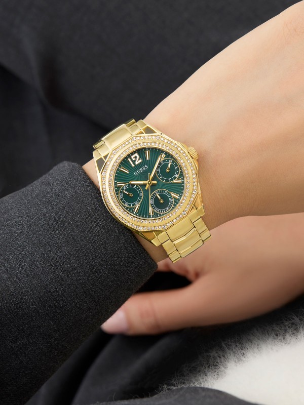 GUESS RITZY ženski multi-function sat u boji žutog zlata sa zelenim sunray brojčanikom i dvorednim cirkonima na koroni. Prečnik 36 mm, vodootpornost 50 m.