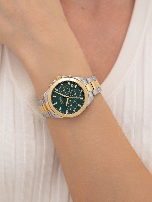 BOSS ALLEY 1502827 – ženski sportsko elegantni sat koji spaja luksuz i praktičnost. Kućište i narukvica od nerđajućeg čelika u dve boje, srebra i žutog zlata, sa upečatljivim zelenim brojčanikom i multifunction kvarcnim mehanizmom. Prečnik kućišta 36mm, mineralno staklo i vodootpornost do 50m čine ovaj model savršenim dodatkom modernom i sofisticiranom stilu.