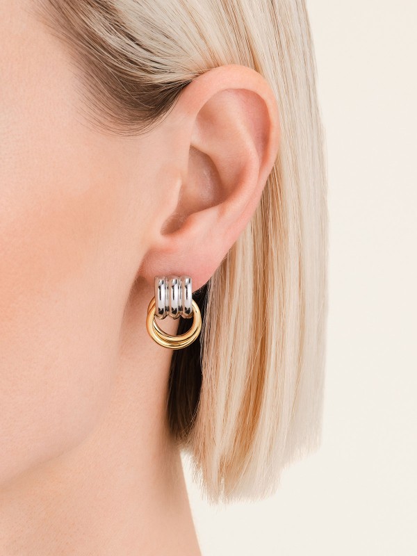 Rosefield JEIED-J964 DUOTONE EARRINGS minđuše spajaju eleganciju i kontrast kroz kombinaciju srebrne i zlatne nijanse. Izrađene od nerđajućeg čelika, ove sofisticirane minđuše pružaju moderan, luksuzan izgled koji se lako uklapa uz svaki stil.