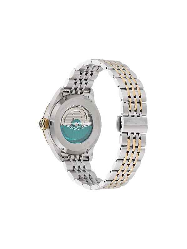 Aston Martin MTTS1F503 – elegantni automatik sat koji odražava spoj britanskog luksuza i vrhunske izrade. Kućište od nerđajućeg čelika prečnika 41mm sa skeleton srebrnim brojčanikom i istorijskim Aston Martin logom iz 1913. godine pruža bezvremenski izgled. Transparentna poleđina otkriva automatski mehanizam sa rotorom u podium zelenoj boji, dok narukvica u kombinaciji srebrne i žutog zlata donosi sofisticiran kontrast. Savršen izbor za muškarce sa stilom i stavom.