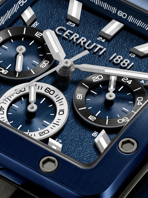 Cerruti 1881 Odissea Master. Crni čelični sat sa teget detaljima. Kvadratno kućište, industrijski zavrtnji i teget silikonska narukvica.