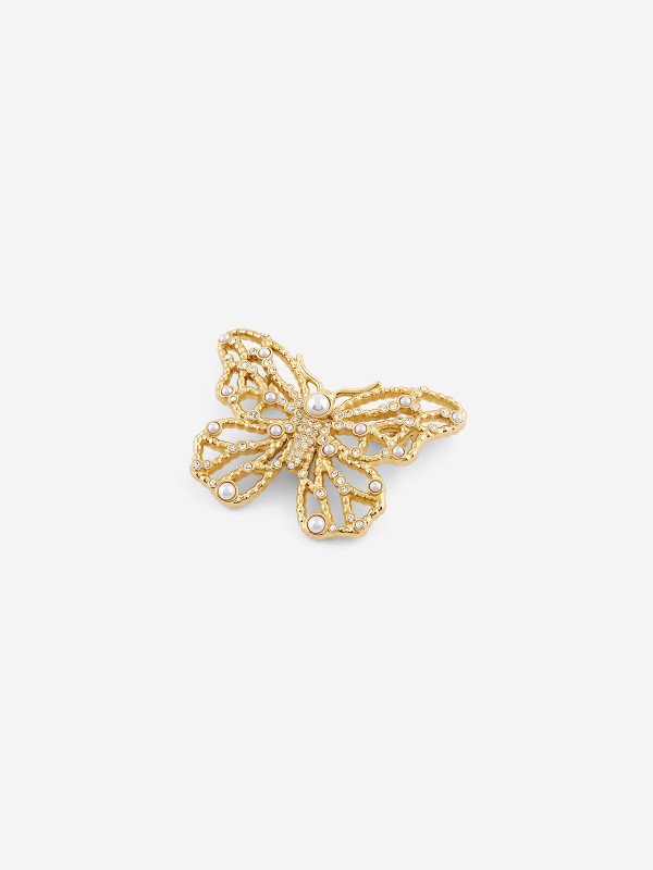 Guess ženski broš od nerđajućeg čelika u boji žutog zlata sa bisernim perlama. Elegantni leptir dizajn za svaku priliku. Kupite odmah online!