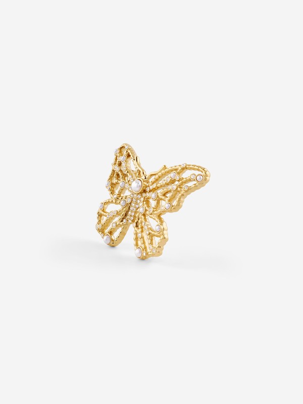 Guess ženski broš od nerđajućeg čelika u boji žutog zlata sa bisernim perlama. Elegantni leptir dizajn za svaku priliku. Kupite odmah online!