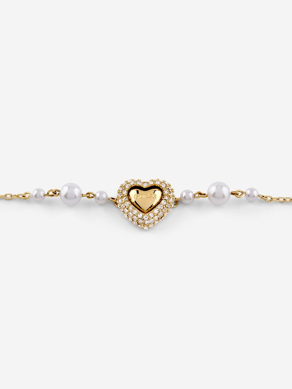 Elegantna Guess ženska narukvica od nerđajućeg čelika u boji žutog zlata sa bisernim perlama. Savršen modni detalj. Poručite online!