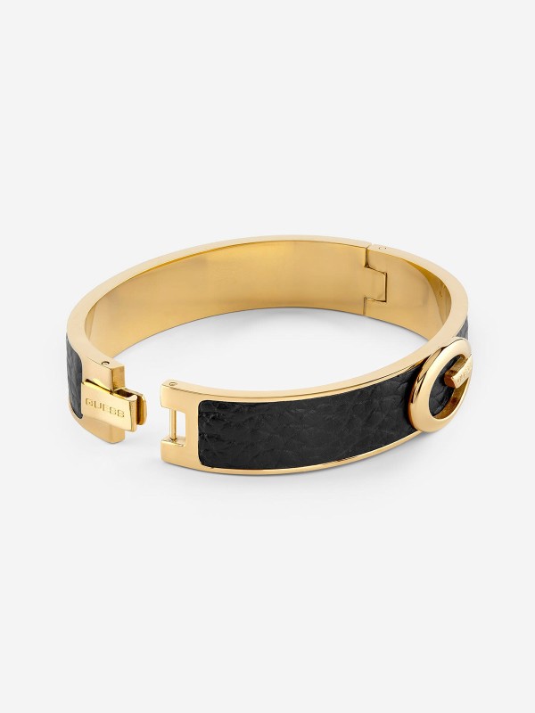 Ženska Guess narukvica u boji žutog zlata sa crnim kožnim umetkom. Nerđajući čelik i elegantan, moderan dizajn. Naruči online!