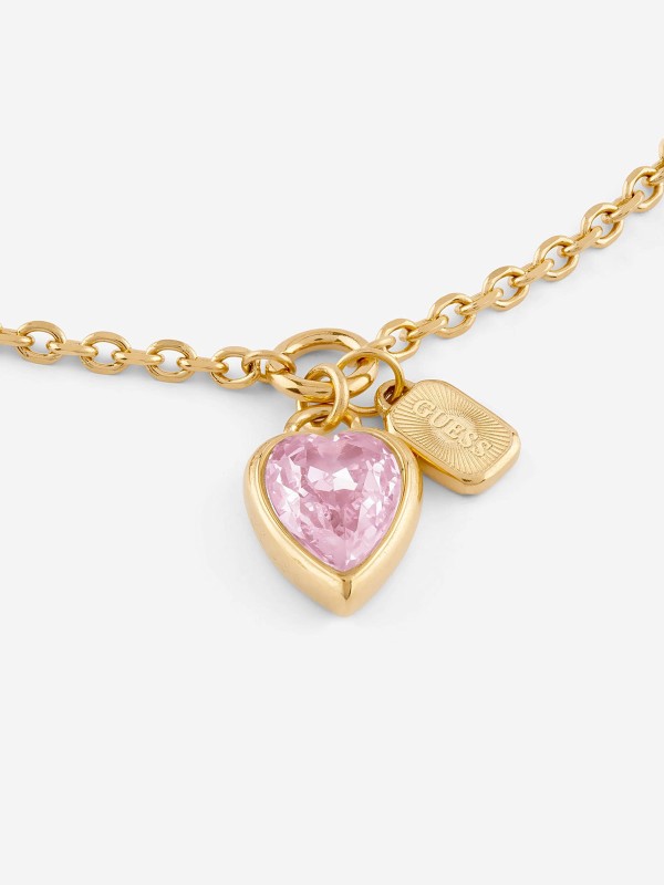 Ženska Guess narukvica u boji žutog zlata sa roze srcem od cirkona. Podesiva veličina i elegantan dizajn. Naruči online!
