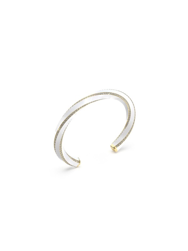 Guess LE MIRAGE JUBB05381JWYGWHS ženska narukvica u boji žutog zlata sa belim emajlom i cirkonima. Moderan model veličine S, prečnik 5,5 × 4,5 cm.