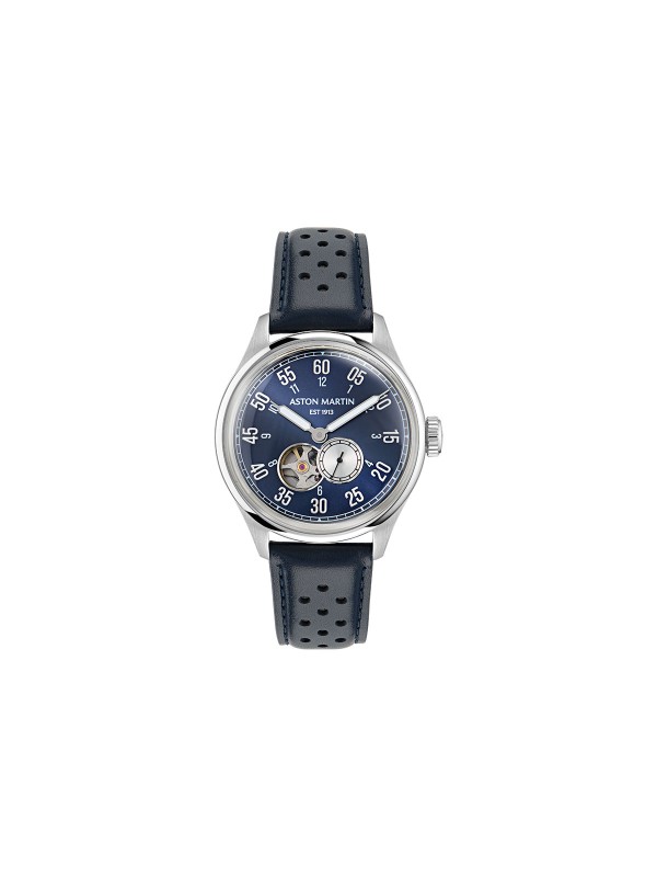 Aston Martin MTTS1F502 – luksuzni automatik sat koji kombinuje eleganciju i tehničku preciznost. Kućište od nerđajućeg čelika prečnika 41mm sadrži skeleton brojčanik u teget boji sa istorijskim logom Aston Martina iz 1913. godine. Transparentna poleđina otkriva automatski mehanizam sa rotorom u prepoznatljivoj podium zelenoj boji. Uparen sa teget kožnom narukvicom, ovaj model spaja britansku sofisticiranost i savremeni dizajn za istinske poznavaoce stila.